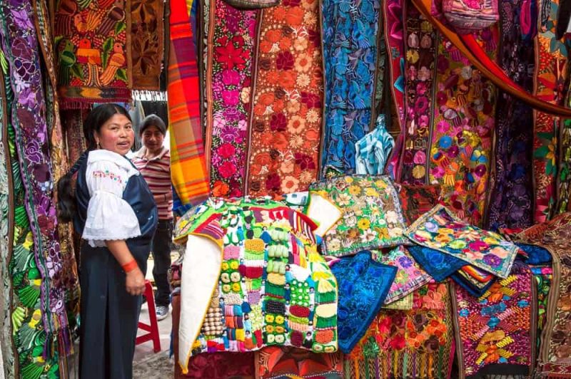 OTAVALO, ECUADOR - AUGUST 4, 2012 Indian women in national clothes sells the products Ecuador 194272517